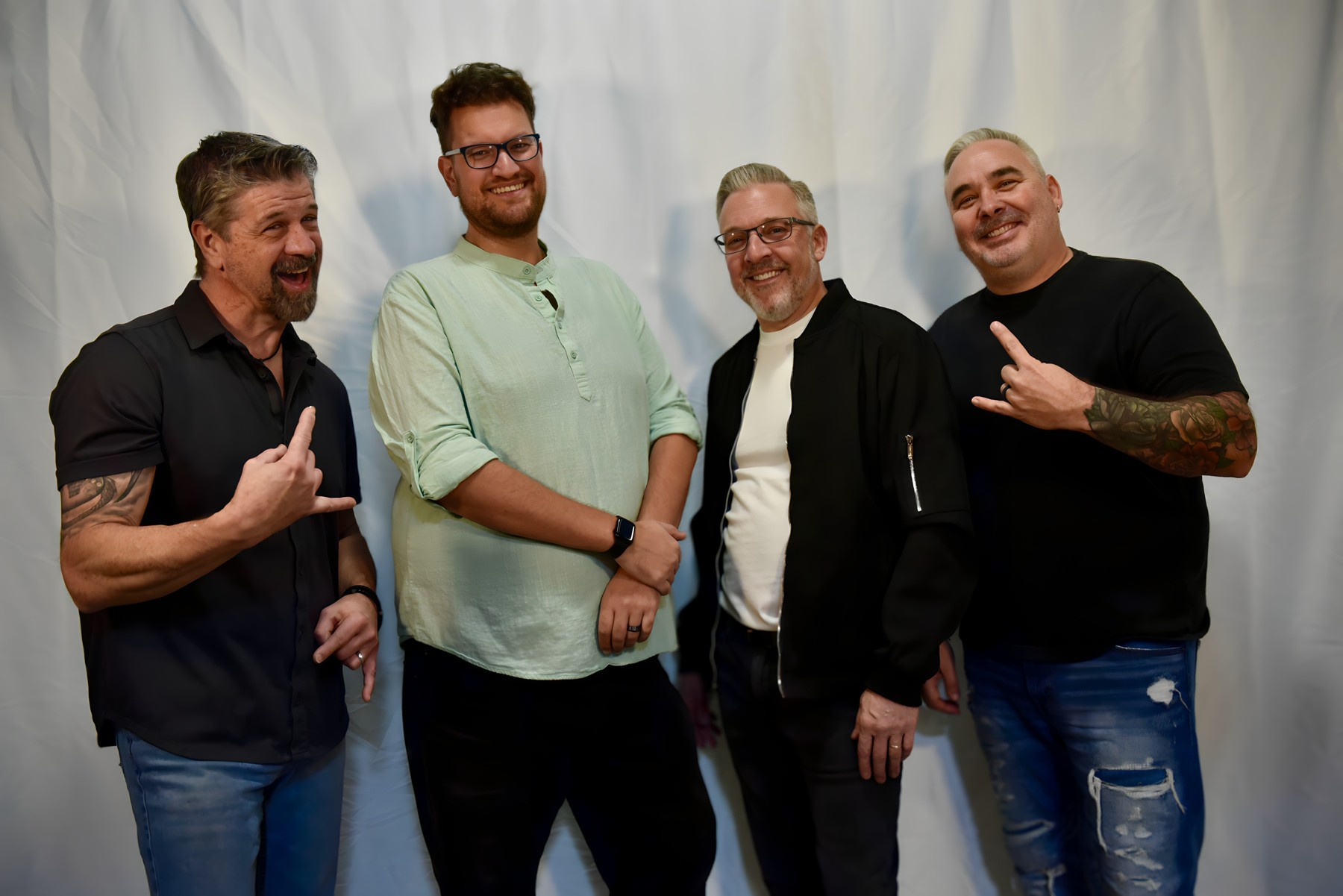 The current Chucks lineup laughing together in a relaxed band portrait