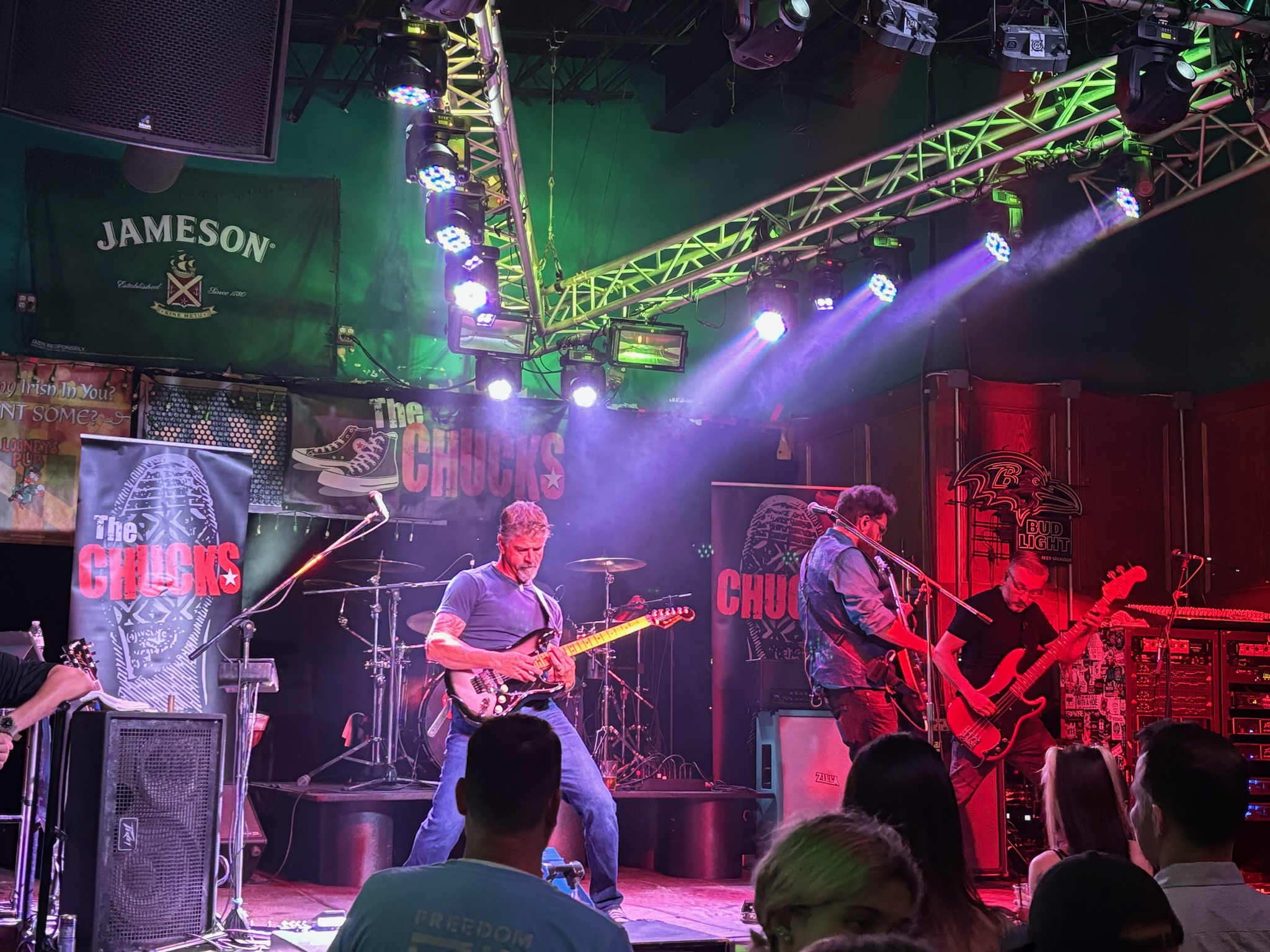 Joe and Neel trading guitar lines under vivid stage lighting