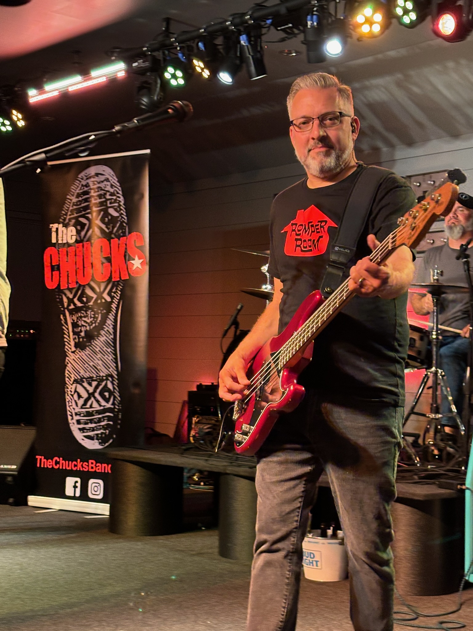 Bill playing bass at the front of the stage